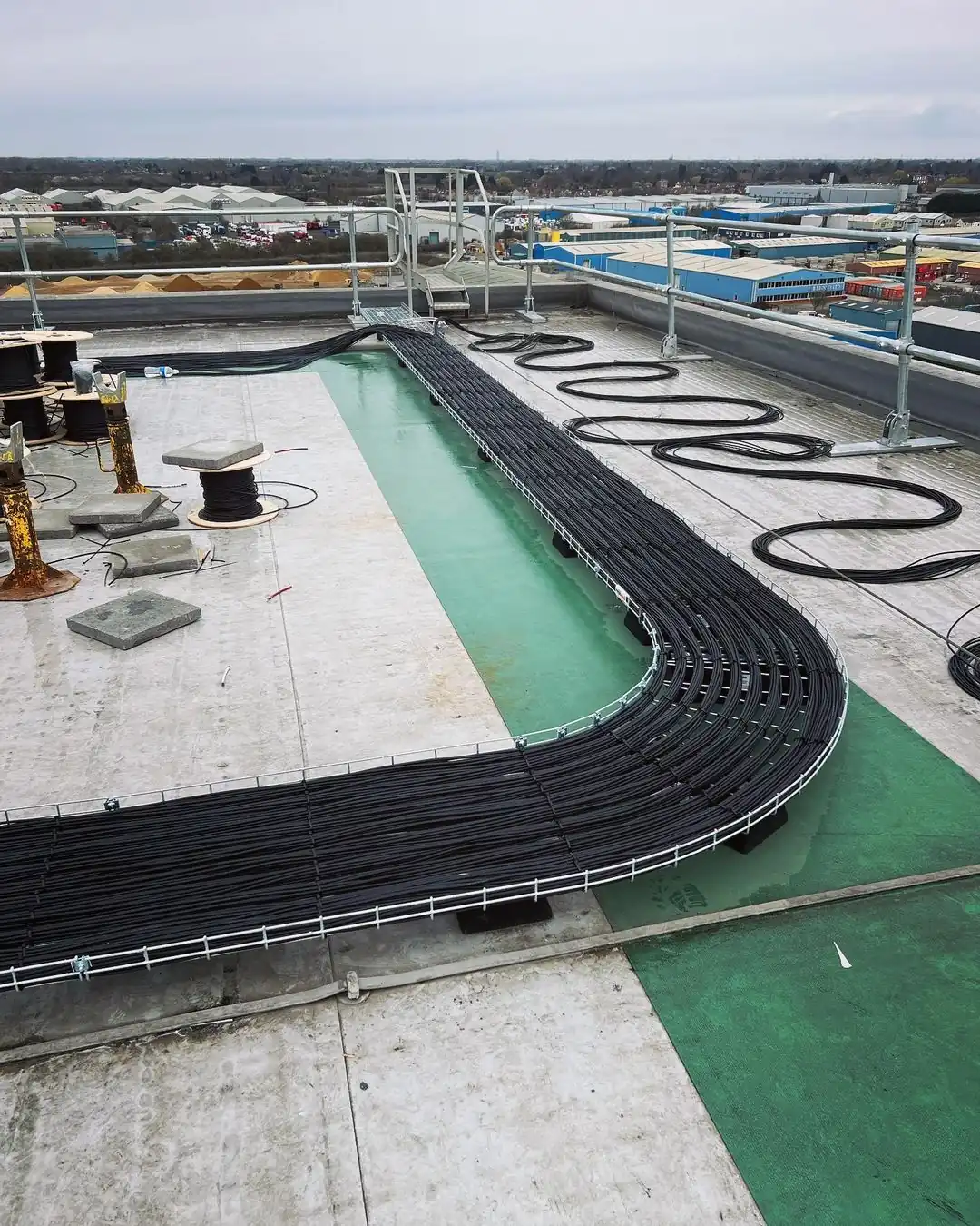 Organized black cables in rooftop cable trays