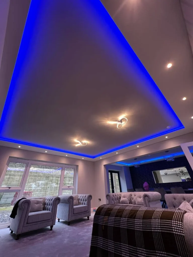 Modern living room with blue LED ceiling lights